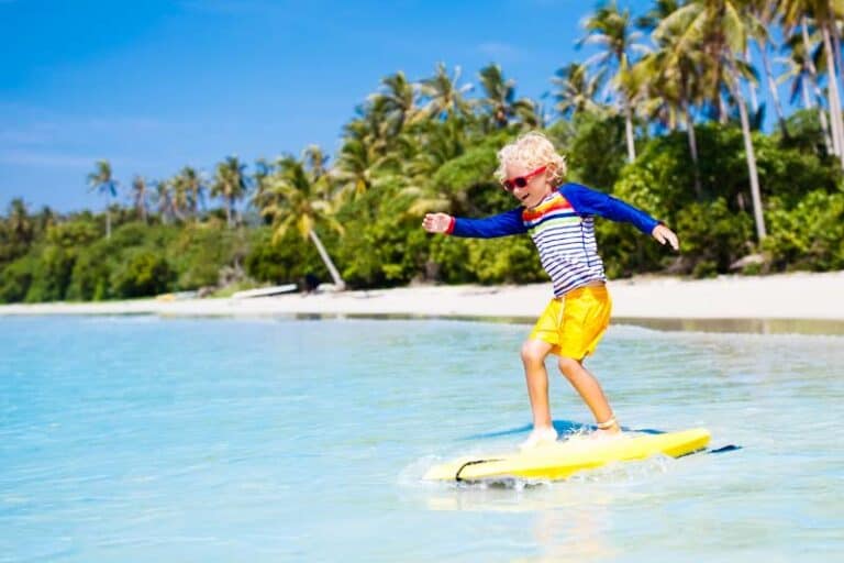 Img child surfing tropical beach