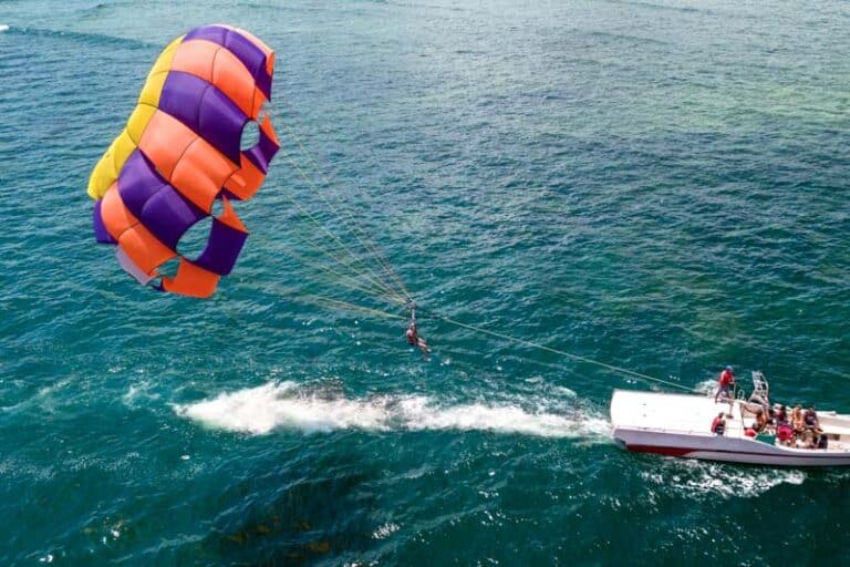 Img colorful parasail wing pulled by boat