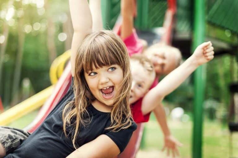 Img kids having fun on slide